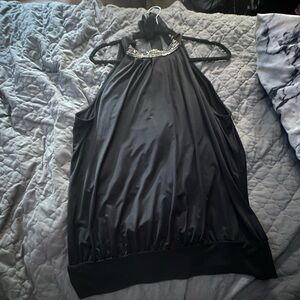 Black with silver/ gold design on neck . Size Large.